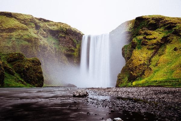 Iceland South Coast 2-Day Tour: Two Waterfalls + Black Sand Beach + Blue Ice Cave + Skaftafell + Glacier Lagoon (18-Person English Minibus Tour)