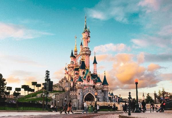 Paris Day Tour: Disneyland Park + Walt Disney Studios Park (2-Park Ticket + Round-Trip Transfers Included • No Guide)